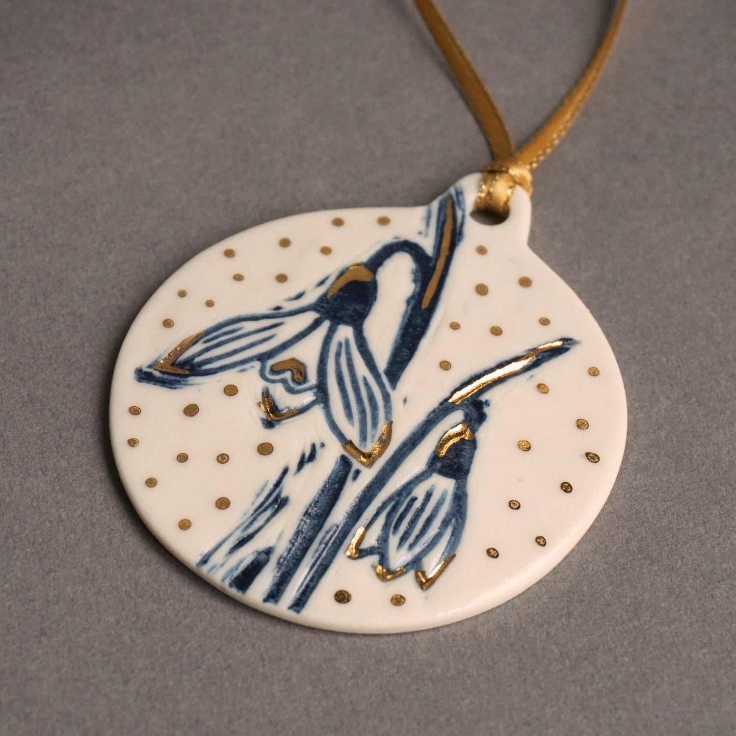 Snowdrop decorations with gold lustre And gold ribbon