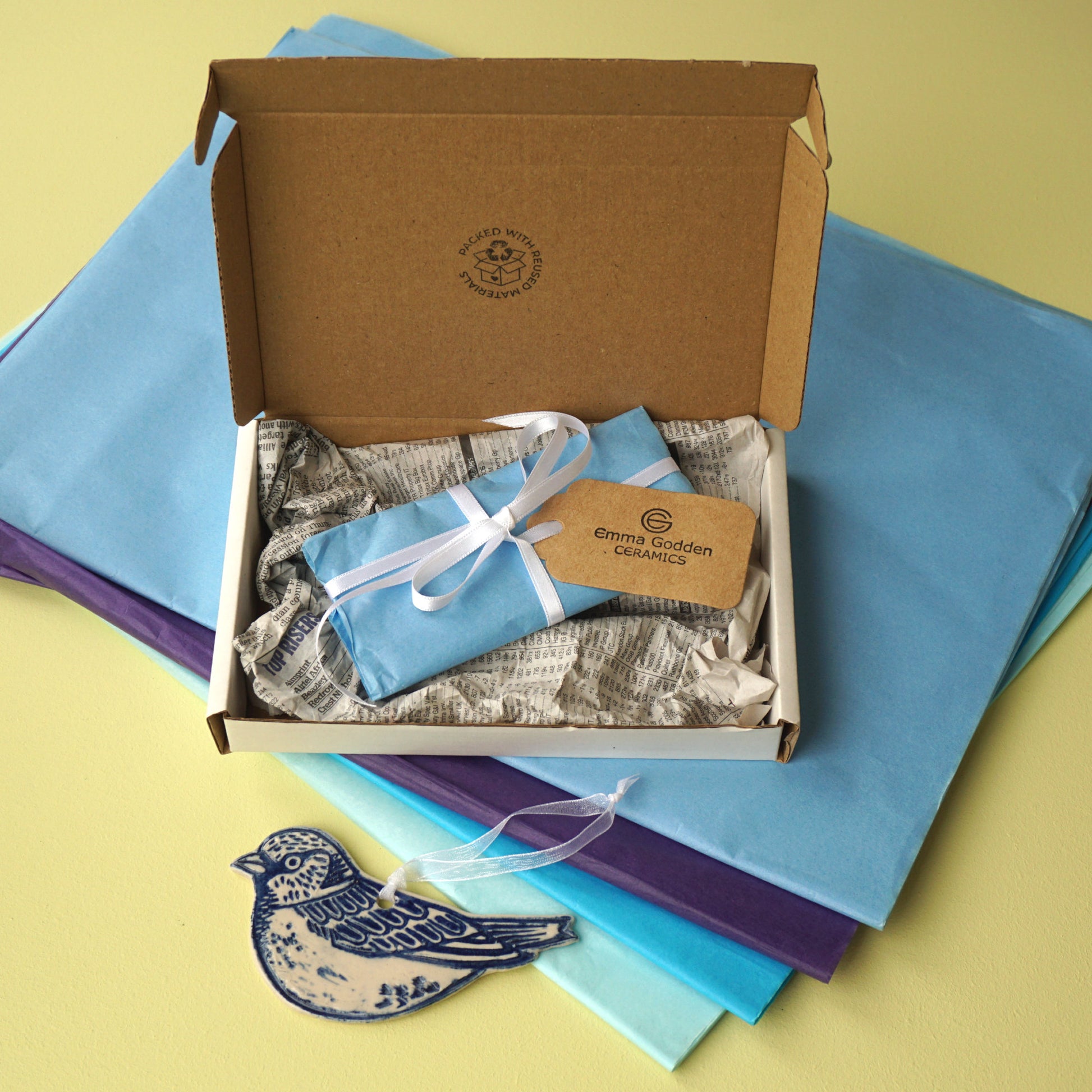 Packaging example Emma Godden Ceramics in large letter box sparrow 